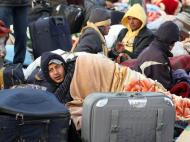 Refugiados líbios na Tunísia [EPA]