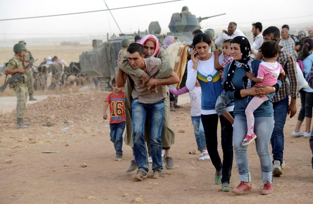 Síria - refugiados entram na Turquia