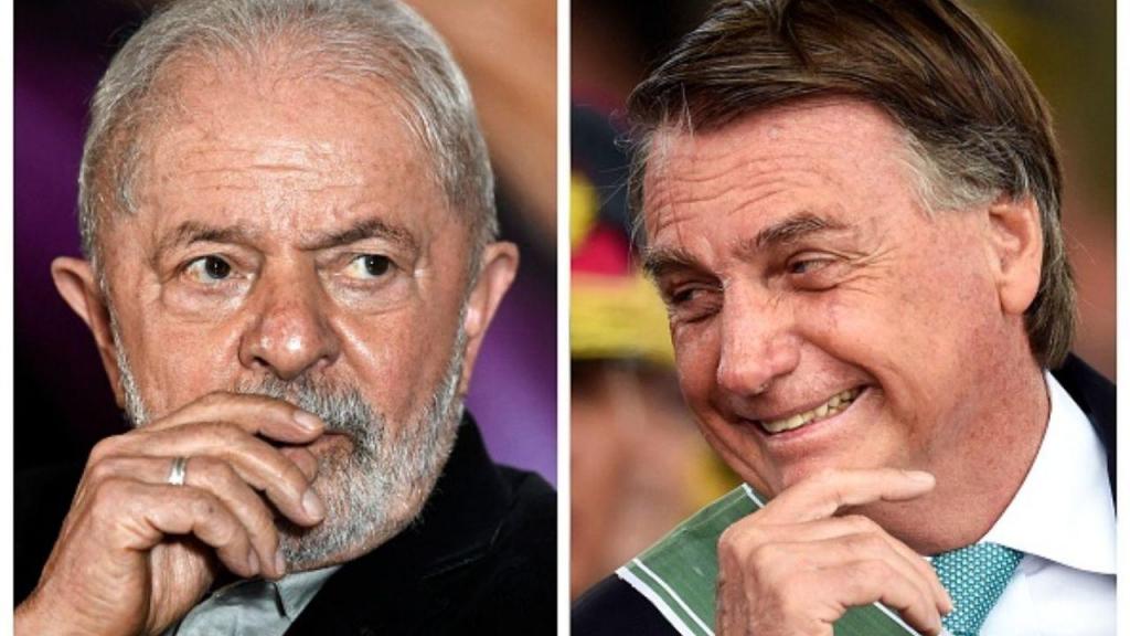O antigo presidente Lula da Silva (à esq.) e o atual chefe de Estado, Jair Bolsonaro (à dir.) (EVARISTO SA/AFP via Getty Images)