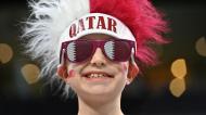 Adeptos com as cores do Qatar na cerimónia de abertura do Mundial 2022